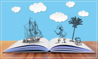 livre ouvert avec dessin d'un bateau et d'un pirate